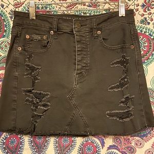 Black destroyed denim mini skirt